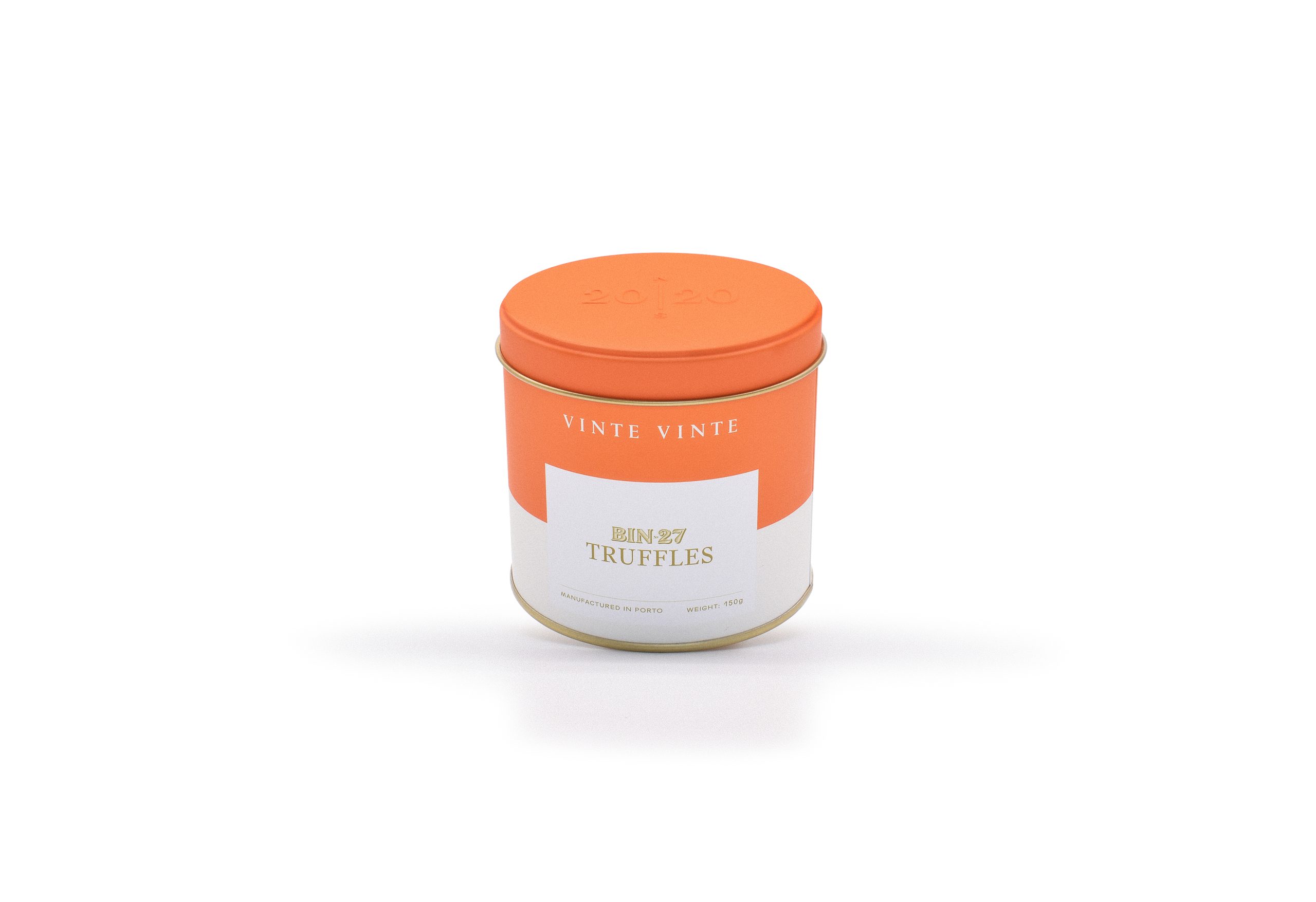 Orange cylindrical tin with a matching orange lid and a white label on the front reading 'TRUFFLES' (gift-style packaging).